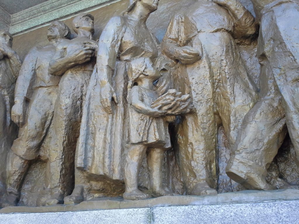 Pic 69 - Relief depicting Polish civilians welcoming the Soviet army.