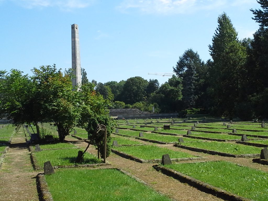 Pic 27 - Mass graves; obelisk in the background.